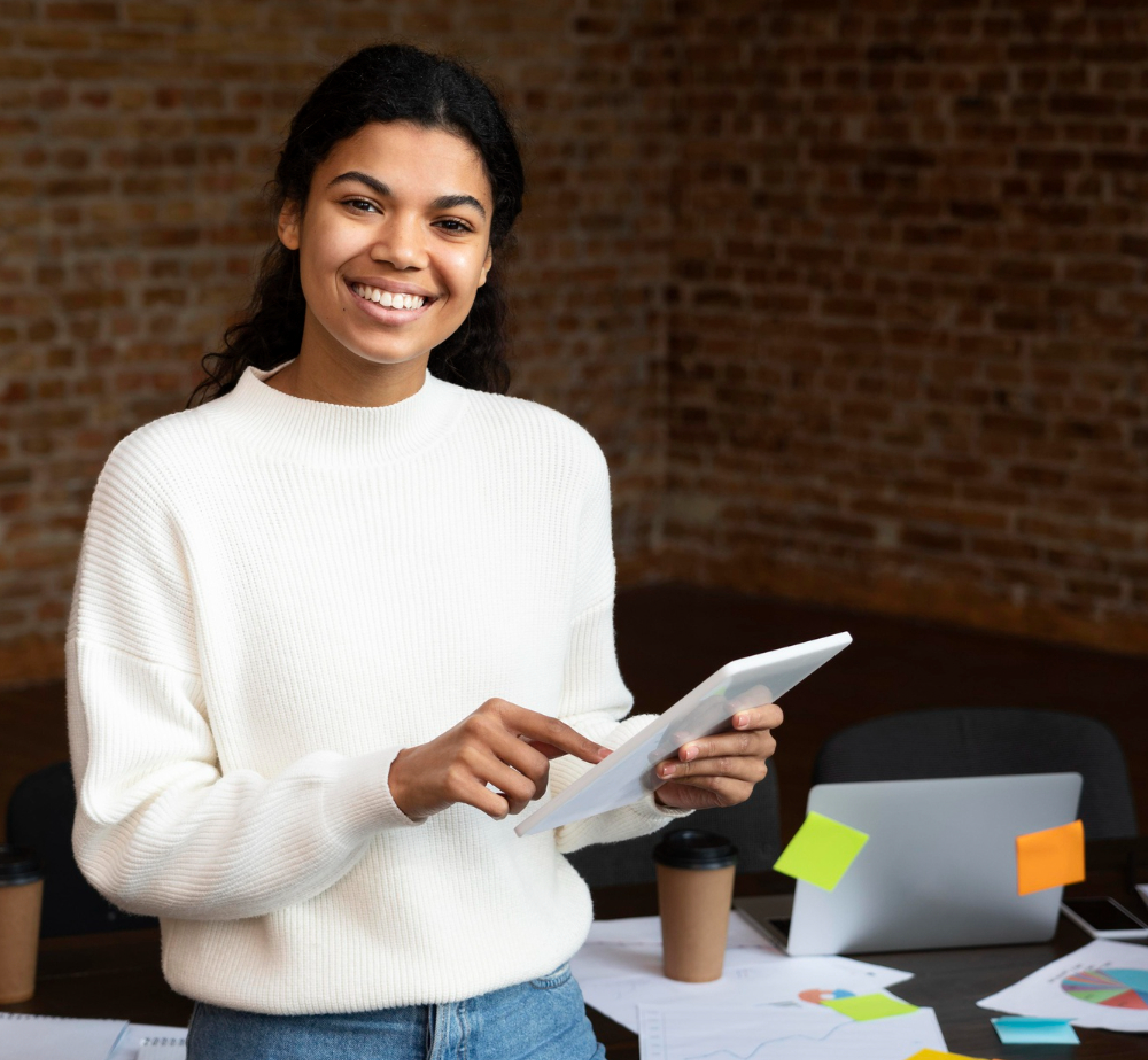One female employee holding tab and working