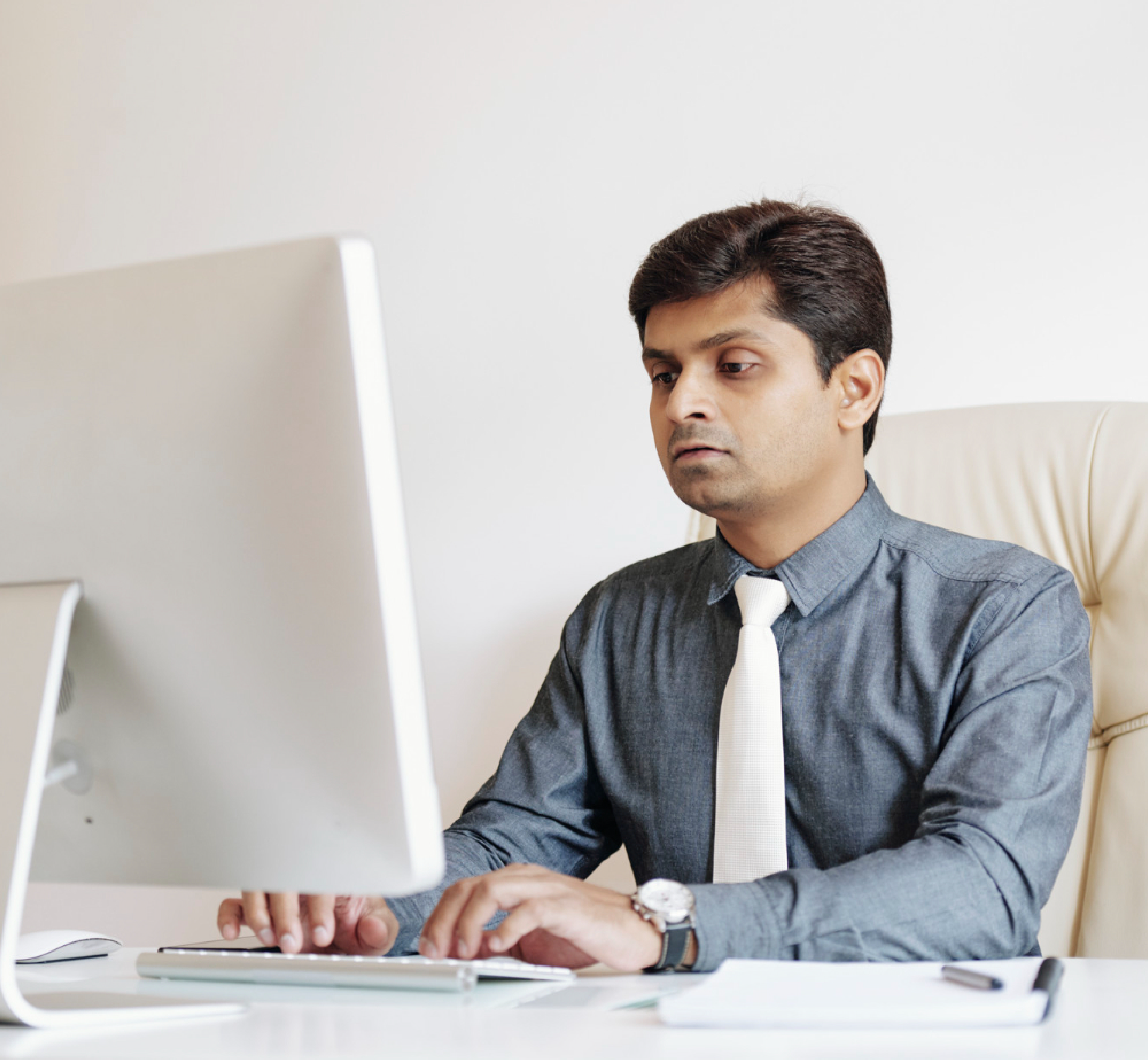 One employee is working on desktop system