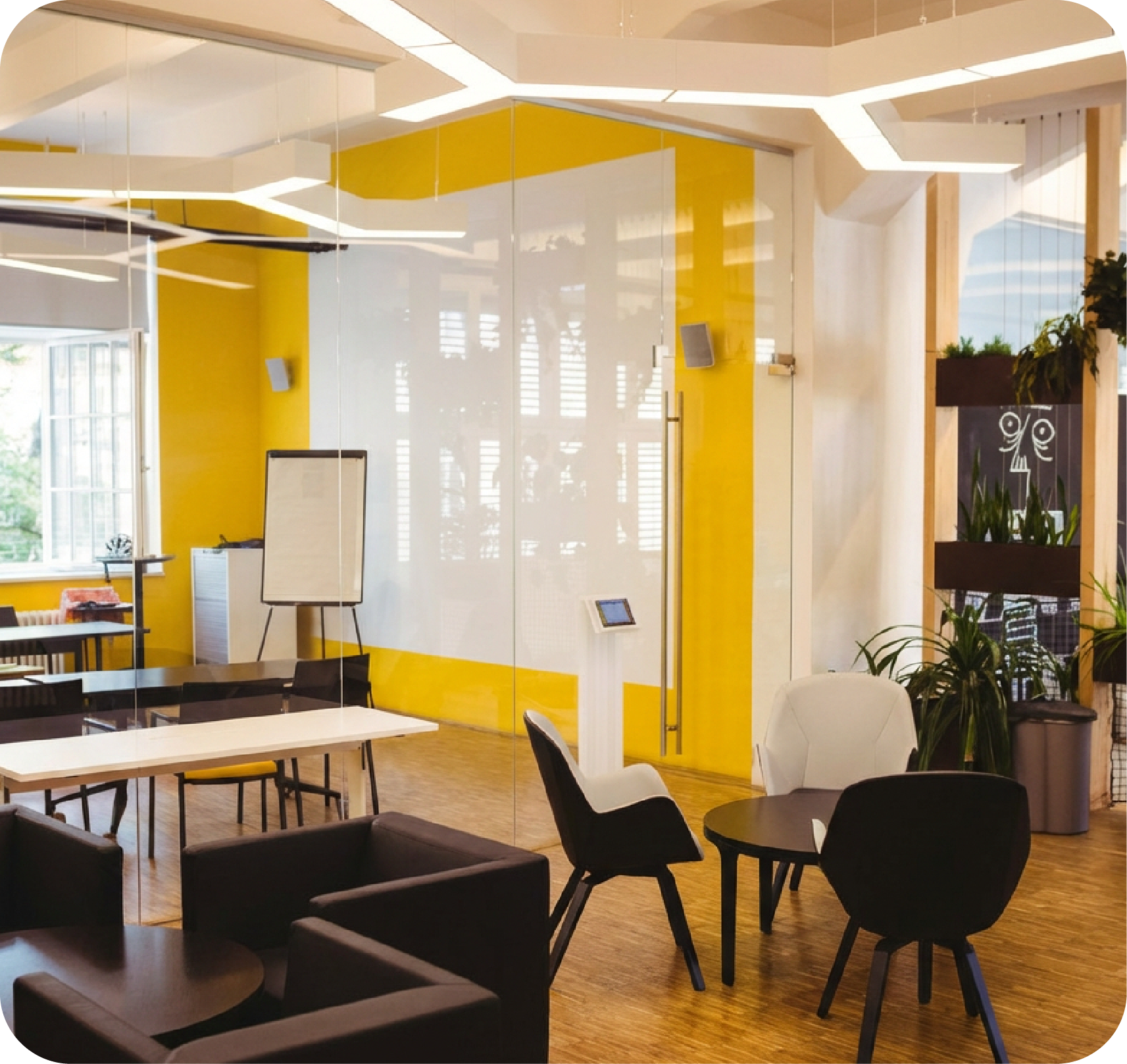 Premium workspace with chairs, tables and greenery